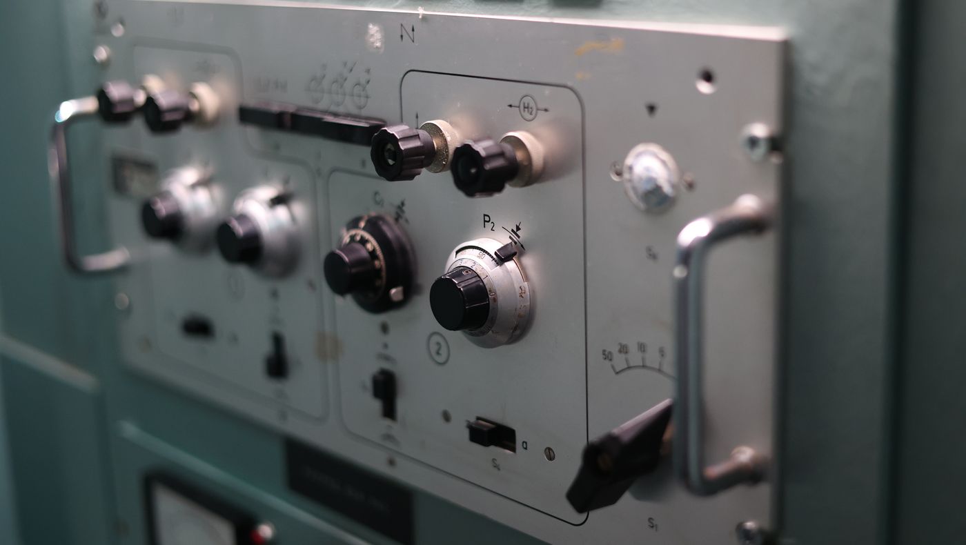 Dials and switches on an industrial control panel