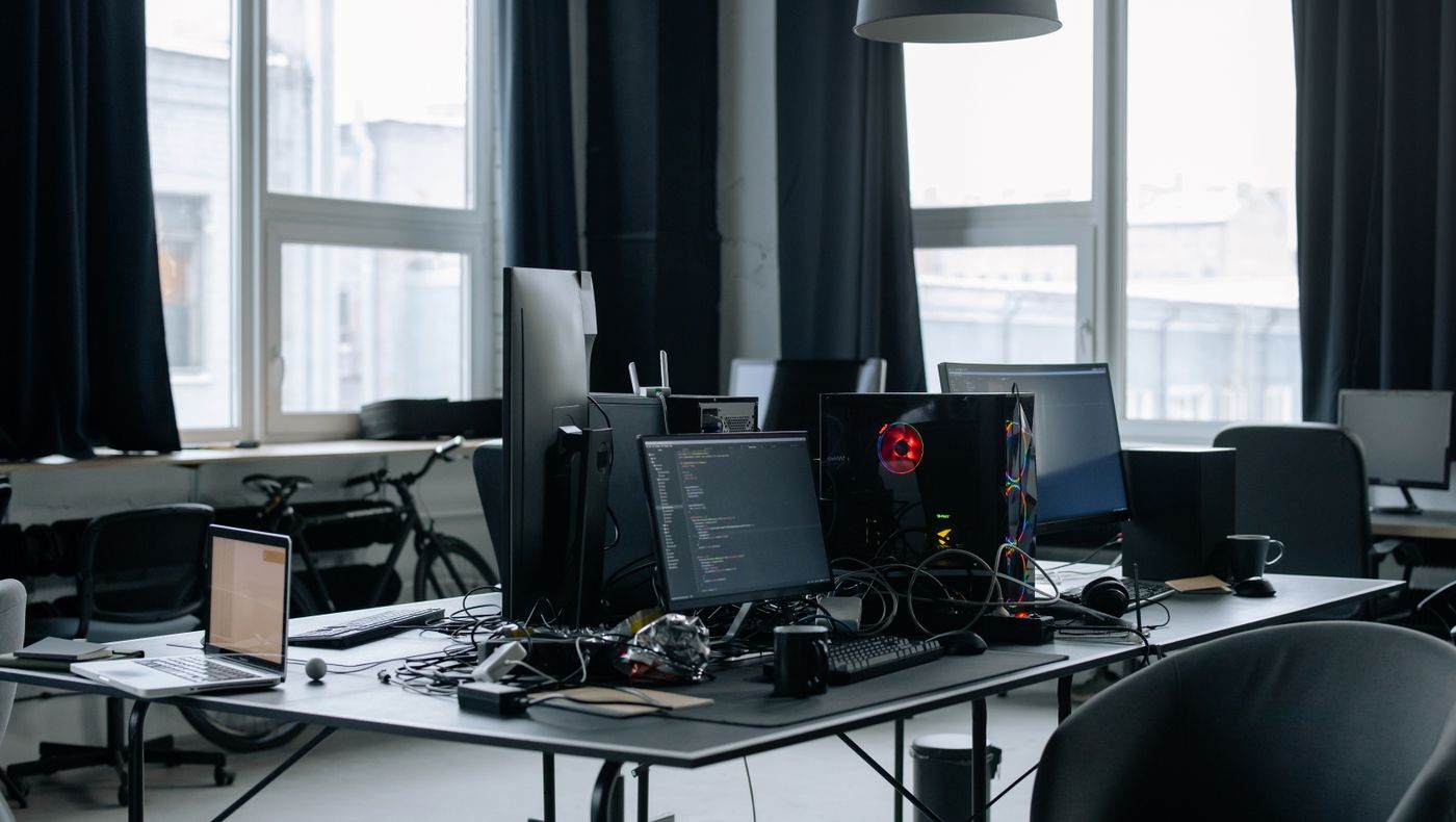 Desks and monitors in an empty software office